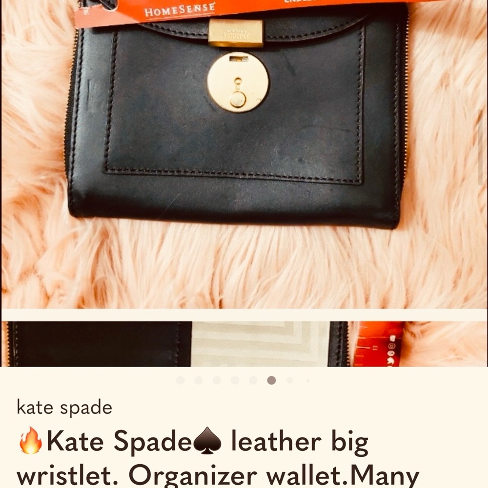 Kate Spade black leather. large compartments Leather Wristlet. Fits so much.